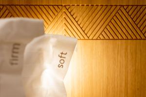 a white cardigan sitting on top of a wooden floor at Holiday Inn Rotorua, an IHG Hotel in Rotorua