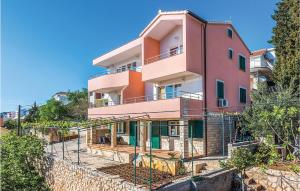 a building under construction with a fence in front of it at Awesome Apartment In Tisno With 2 Bedrooms And Wifi in Tisno