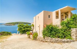 a house with a view of the water at Stunning Apartment In Gruda With 2 Bedrooms And Wifi in Molunat