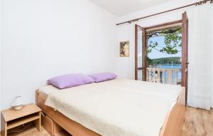 Posteľ alebo postele v izbe v ubytovaní Apartment Gruda Molunat Ii
