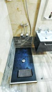 a bathroom with a shower and a sink at Hola Madrid Alojamiento Temporal in Madrid +31 photos
