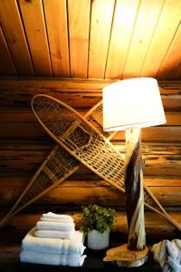 a lamp on a table in a room with a ceiling at Hope Alaska's Bear Creek Lodge in Hope