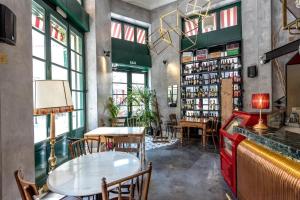 a restaurant with a table and chairs in a room at City Circus Athens in Athens