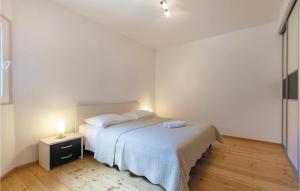Posteľ alebo postele v izbe v ubytovaní Two-Bedroom Holiday Home