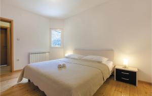 Posteľ alebo postele v izbe v ubytovaní Two-Bedroom Holiday Home