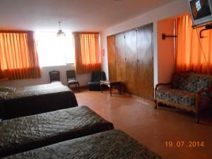 Postel nebo postele na pokoji v ubytování Hostal Cesar Alberto