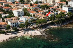 an aerial view of a beach in a city at Hotel Ristorante La Conchiglia in Cala Gonone
