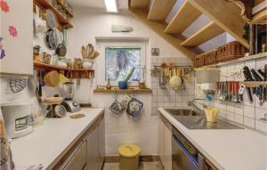 a kitchen with a sink and a counter top at Nice Home In Mali Losinj With Sauna in Mali Lošinj