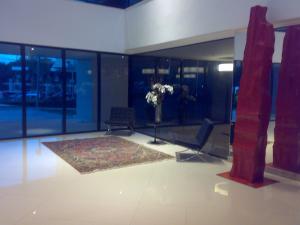 a lobby with a vase of flowers in a room at Flat Mar Vip in Fortaleza