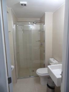 a bathroom with a shower and a toilet and a sink at Flat Mar Vip in Fortaleza