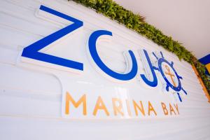 a sign for a marina bay cruise ship at ZOJO MARiNA BAY in San Andrés