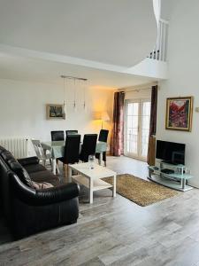a living room with a couch and a table at Heart of Kinsale in Kinsale