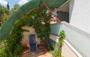 a wreath of vines on the side of a house at Nice Apartment In Stari Grad With Wifi in Stari Grad