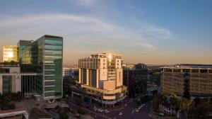 an aerial view of a city with tall buildings at Radisson Blu Gautrain Hotel, Sandton Johannesburg in Johannesburg