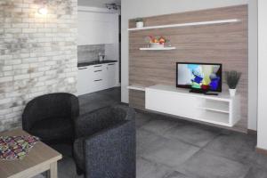 TV a/nebo společenská místnost v ubytování Apartments, Miedzyzdroje