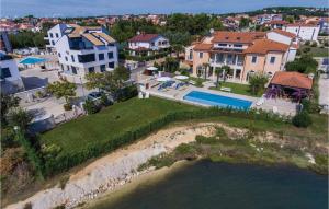 an aerial view of a house with a swimming pool at Amazing Apartment In Medulin With Kitchen in Medulin