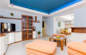a living room with a blue ceiling at Gorgeous Apartment In Slano With Kitchen in Slano