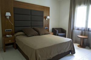 Posteľ alebo postele v izbe v ubytovaní Hotel Restaurant Castellarnau