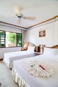 En eller flere senge i et værelse på Sea Garden Resort & Spa, Haadrin