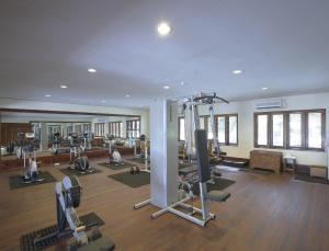 a gym with several treadmills and machines in a room at Filitheyo Island Resort in Filitheyo