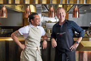 two men standing next to each other in a kitchen at Kimpton Margot Sydney, an IHG Hotel in Sydney
