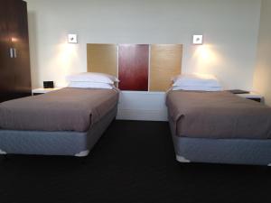 Postel nebo postele na pokoji v ubytování Auldington Hotel