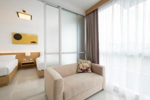 Postel nebo postele na pokoji v ubytování Modern Thai Suites