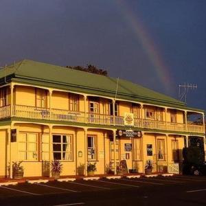 a large building with a sky background at Mangonui Hotel in Mangonui