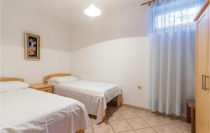 Tempat tidur dalam kamar di Nice Apartment In Pula With 2 Bedrooms And Wifi
