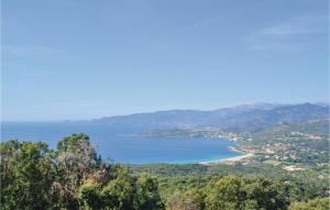 a view of a body of water from a hill at Stunning Apartment In Calcatoggio in Calcatoggio