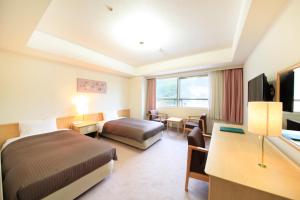 Postel nebo postele na pokoji v ubytování Hotel Mahoroba + 49 fotografií