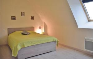 a bedroom with a bed with a yellow blanket at Pet Friendly Home In Saint Alban in Saint-Alban