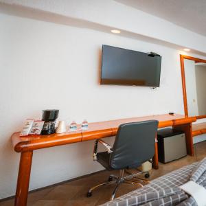 TV a/nebo společenská místnost v ubytování Hotel Los Patios