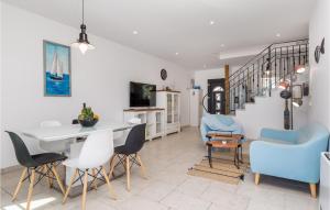 a living room with a dining room table and chairs at 3 Bedroom Nice Home In Kornic in Kornić