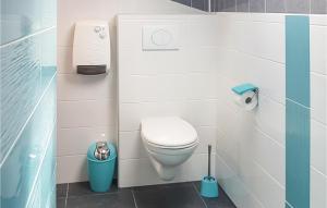 a small bathroom with a toilet and a trash can at Gorgeous Home In Mont-Dol With Wifi in Mont-Dol