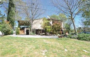 an old house in a yard with a grass field at 1 Bedroom Amazing Apartment In Lorgues in Lorgues