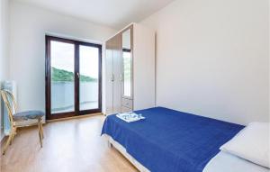 Ein Bett oder Betten in einem Zimmer der Unterkunft Amazing Home In Icici