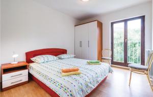 Ein Bett oder Betten in einem Zimmer der Unterkunft Amazing Home In Icici