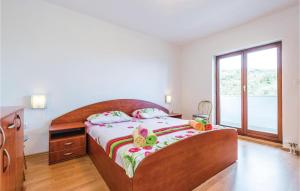 Ein Bett oder Betten in einem Zimmer der Unterkunft Amazing Home In Icici