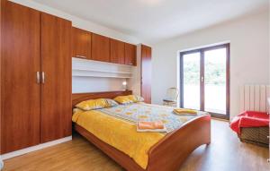 Ein Bett oder Betten in einem Zimmer der Unterkunft Amazing Home In Icici
