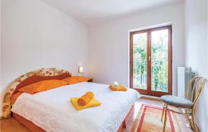 Ein Bett oder Betten in einem Zimmer der Unterkunft Amazing Home In Icici