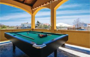 a pool table in a room with a view at 3 Bedroom Lovely Home In Vrsi in Vrsi