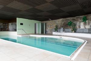 a large swimming pool in a building at Collina d'Oro Orselina Locarno in Locarno