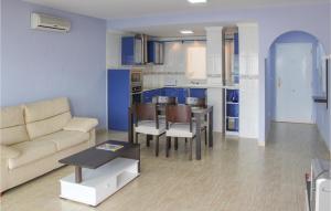 a living room with a couch and a table at Amazing Apartment In La Azohía in La Azohía