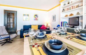 a living room with a table with wine glasses on it at Stunning Apartment In La Herradura-almuecar With Kitchen in La Herradura