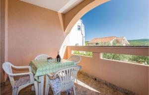 a table and chairs on a balcony with a view at 1 Bedroom Stunning Apartment In Kornic in Kornić