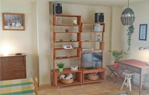 a living room with a television and a desk at Awesome Home In Altea With 2 Bedrooms in Altea