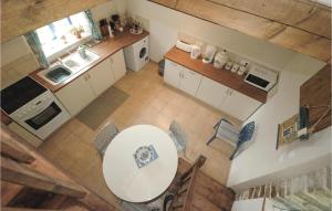 Kuchyň nebo kuchyňský kout v ubytování Holiday Home Le Faouet P-728