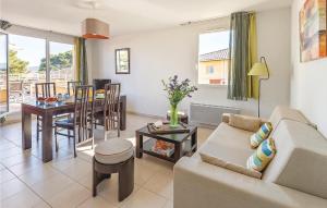 a living room with a couch and a table at Les Terrasses Des Embiez in Six-Fours-les-Plages