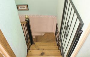 a stairwell with a wooden staircase with a stair railing at Two-Bedroom Holiday Home In Los Alcazares in Los Alcázares